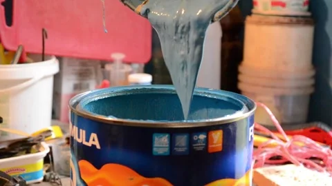 We change the old blue paint to another container. Stock Footage 140579174