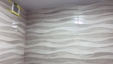 We check the work of the tiler in the bathroom, new tile. Vídeos de archivo 249312170