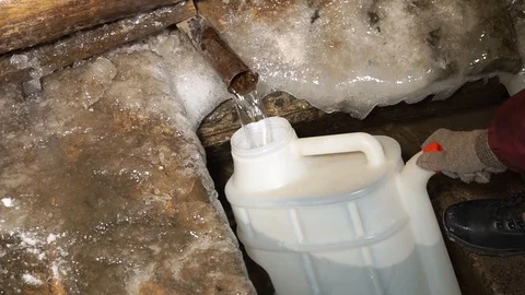 We collect water from the well. Very fresh and tasty water. Stock Footage 99632353