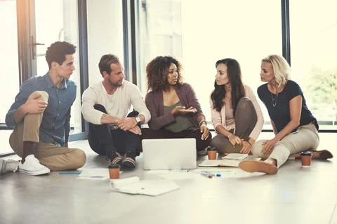 We could include that idea in our latest creative campaign. a team of designers Foto stock