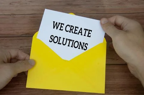 We create solutions text on white notepad in yellow envelope. Solution concep Фото