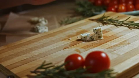We cut cheese Danish Blue Cheese and tomatoes . 4K video Stock Footage 144547721