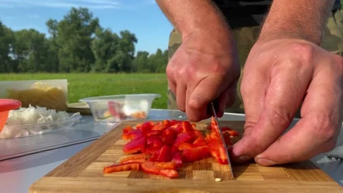 We cut red pepper, for cooking pasta with sausages Stock Footage 157430127