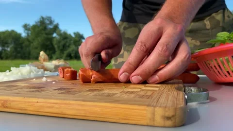We cut the sausages in plastic wrap for cooking pasta Stock Footage 157430382