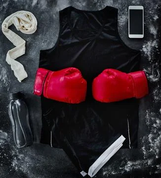 We did well. High angle shot of boxing essentials placed on top of a dark Stock Photos