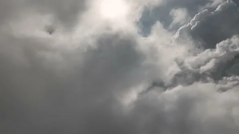 We fly through beautiful thick fluffy clouds on a sunny day. Amazing timelapse Stock Footage 210470821