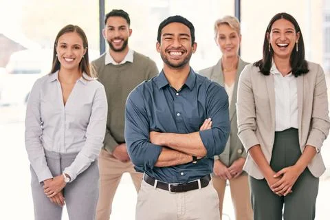 We get things done with a smile on our faces. a diverse group of businesspeople Stock Photos