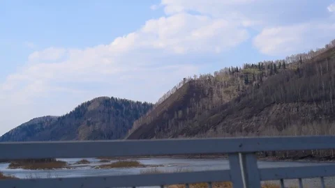 We go by car bridge across the river from one Bank to the other Stock Footage 111499715