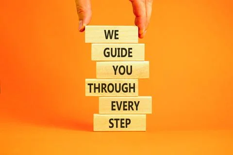 We guide you through every step symbol. Concept words We guide you through .. Stockfoto's