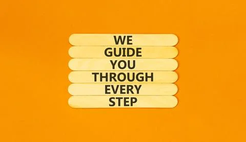 We guide you through every step symbol. Concept words We guide you through .. Stockfoto's