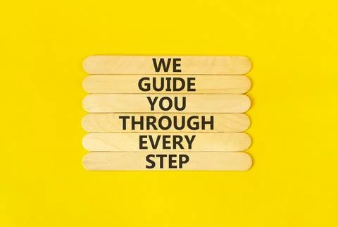 We guide you through every step symbol. Concept words We guide you through .. Stockfoto's