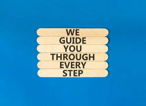 We guide you through every step symbol. Concept words We guide you through .. Stockfoto's