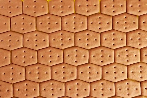 We lay out the background from hexagonal cookies. A tasty and sweet snack. Stock Photos