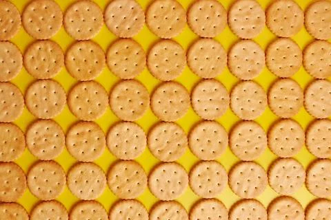 We lay out the background from round cookies. A tasty and sweet snack. Stock Photos