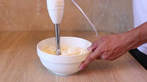 We make the cheese with the blender. I grind the cheese with the blender Stock Footage 158549088