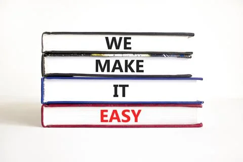 We make it easy symbol. Concept words We make it easy on books. Beautiful whi 스톡 사진