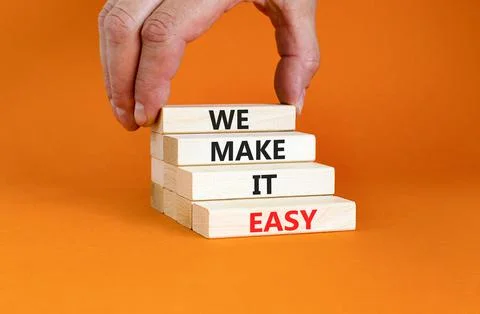 We make it easy symbol. Concept words We make it easy on wooden cubes. Beauti Stock Photos