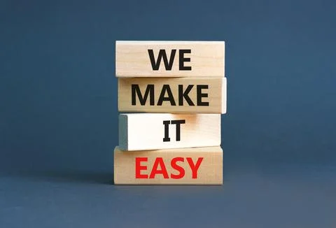 We make it easy symbol. Concept words We make it easy on wooden cubes. Beauti 스톡 사진