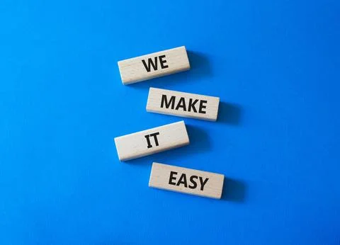 We Make it Easy symbol. Concept words We Make it Easy on wooden blocks. Bea.. Stock Photos