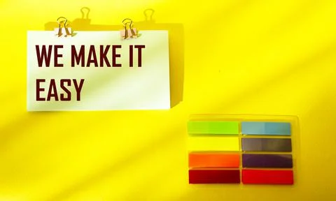 We make it easy The text is written on a sticker and a yellow background Stock Photos