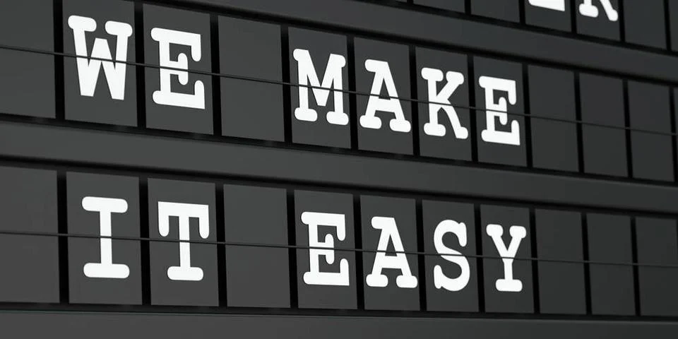 We make it easy. We make it easy. Black timetable display with white text.... Stock Photos