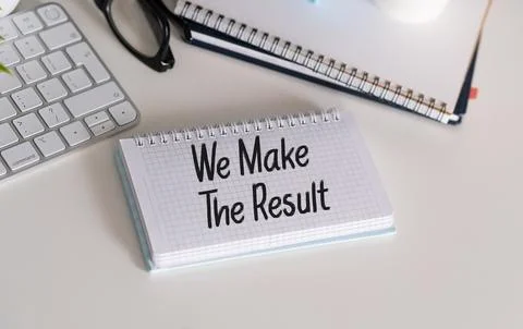 WE MAKE RESULT text on a paper with glasses and keyboard on a white backgroun Stock Photos