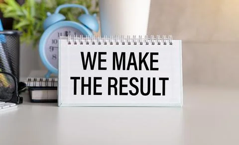 WE MAKE RESULT text on a paper with glasses and keyboard on a white backgroun Stock Photos