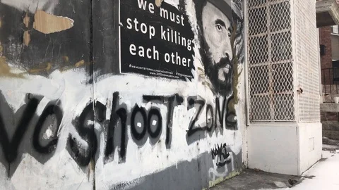 We most stop killing each other, message on building wall in New Baltimore Vidéo 89758352