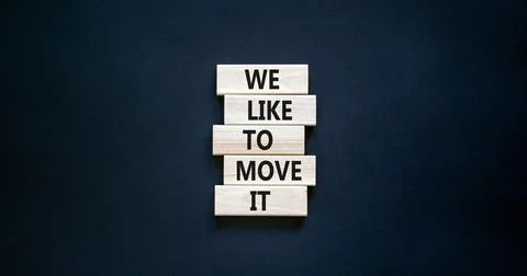 We like to move it symbol. Concept words We like to move it on wooden blocks. Stock Photos