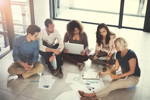 We need to avoid any potential pitfalls. a team of designers brainstorming on Foto stock