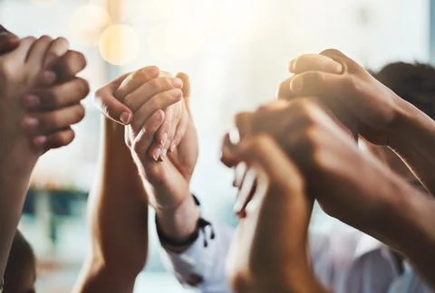 We need to encourage and uplift one another. Closeup shot of a group of Stock Photos