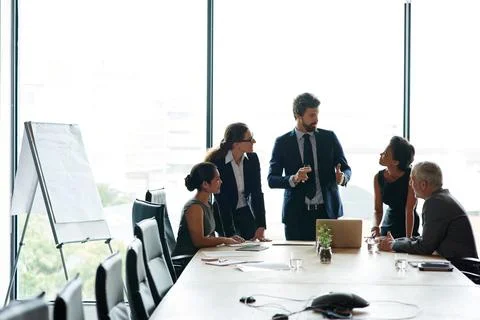 We need everyone on the same page. a group of executives having a meeting in a 写真素材