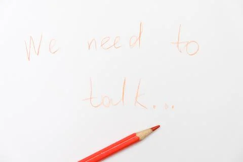 We need to talk message written on white paper, communication problems in family Stock Photos