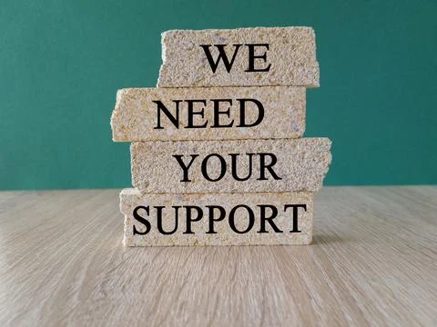 We need your support symbol. Brick blocks with words We need your support. Stock Photos