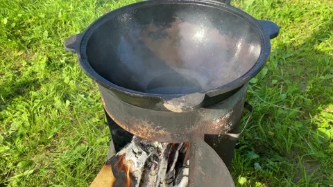 We prepare the cauldron for cooking Stock Footage 157431653