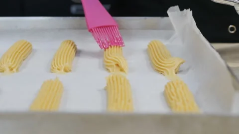 We prepare custard French eclairs at home. Lubricate cocoa with butter Stock Footage 161152588