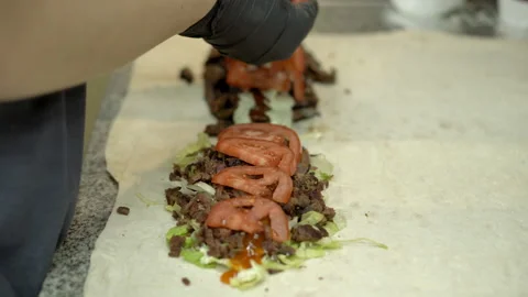 We prepare shawarma from vegetables and meat. Stock Footage 278992214