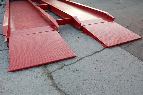 We provide Industrial Red Loading Ramps for efficient vehicle access and Stock Photos
