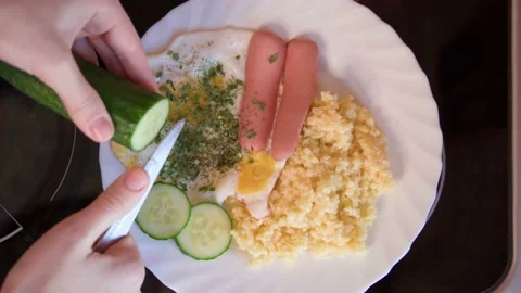 We put the pan with fresh scrambled eggs and bacon on the table with porridge Stock Footage 171057154