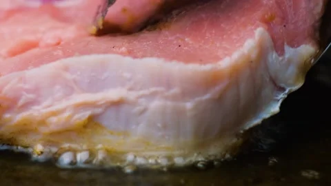 We put a piece of meat in a frying pan Stock Footage 247578000
