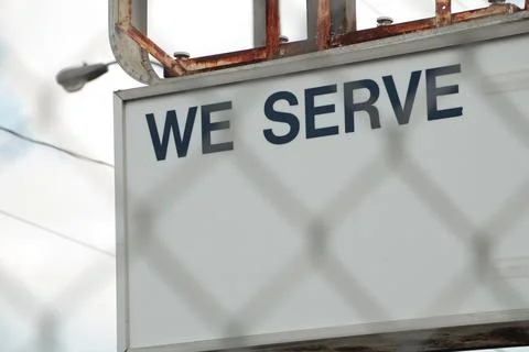 We serve caption text writing billboard horizontal rectangle sign on metal posts 스톡 사진