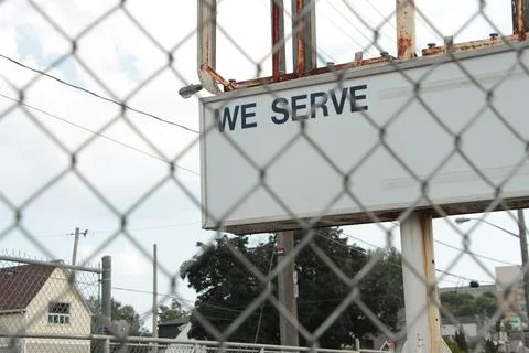 We serve caption text writing billboard horizontal rectangle sign on metal posts 스톡 사진