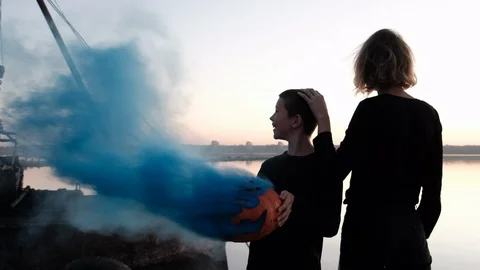 We set fire to the pumpkin on Halloween evening at sunset. Blue smoke comes out Stock Footage 102885262