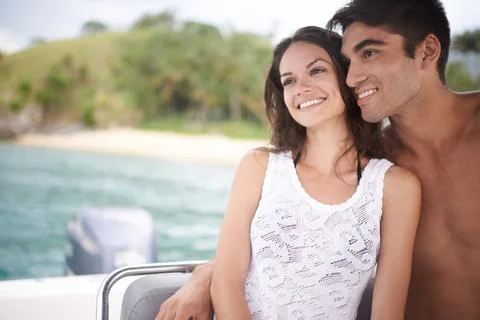 We should do this every year. an affectionate young couple enjoying a boat ride Fotos Stock