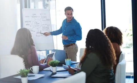 We solve every problem in our meetings. a businessman delivering a presentation Foto stock