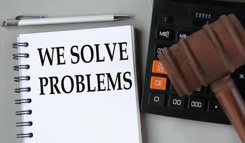 WE solve problems - words in a white notebook on the background of a calculat Stock Photos