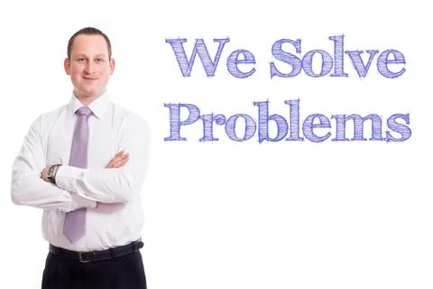 We Solve Problems - Young businessman with blue text Stock Photos