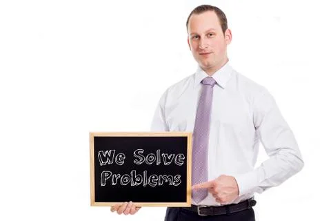 We Solve Problems - Young businessman with blackboard Stock Photos