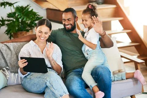 We take each day to connect as a family. a happy family making a video call on a Fotos Stock