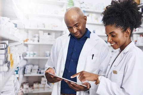 Since we used this software, we never went back. two pharmacists doing inventory Stock Photos